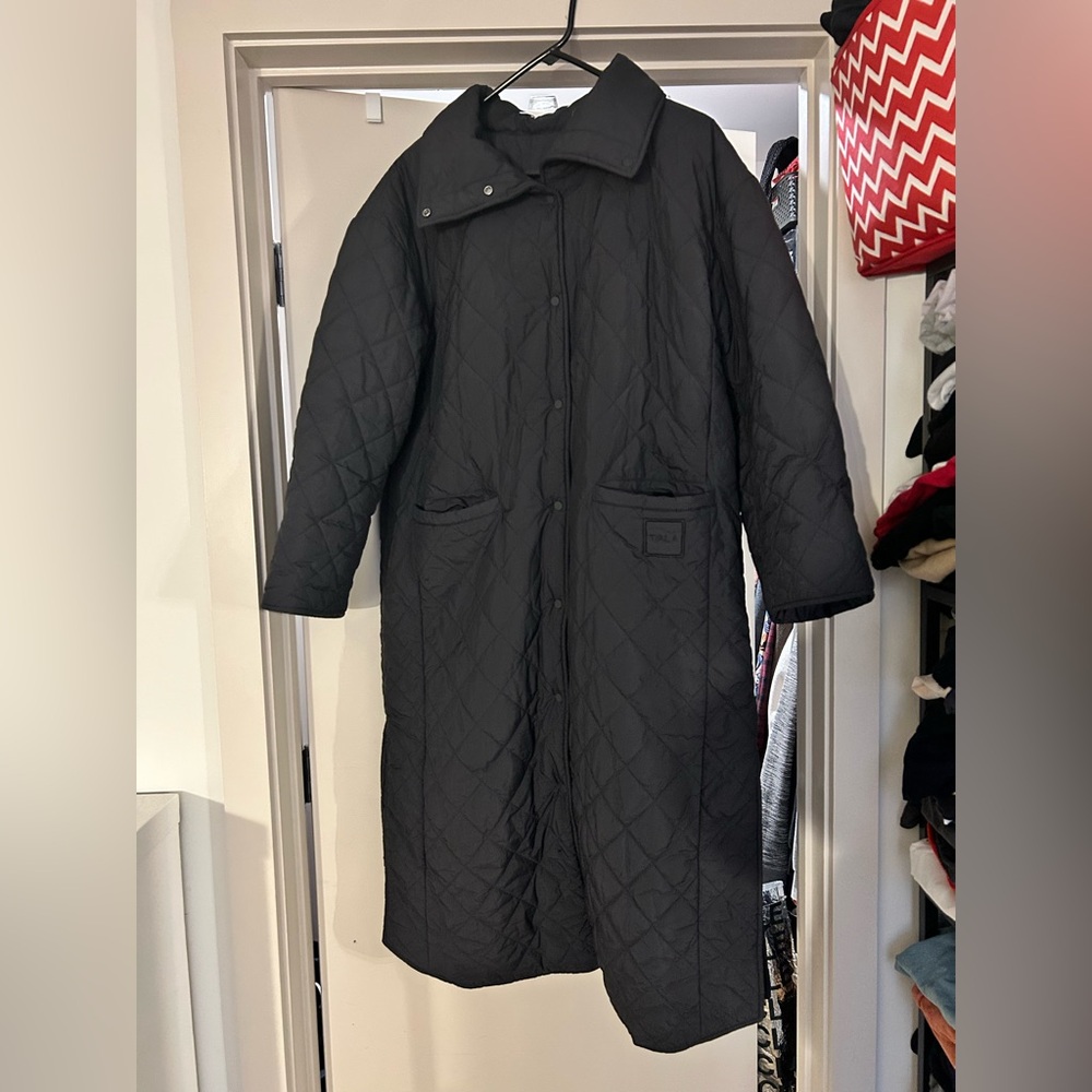 WE ARE T/ALA REVERSIBLE PADDED AND QUILTED LONGLINE EVERYTHING OVERCOAT